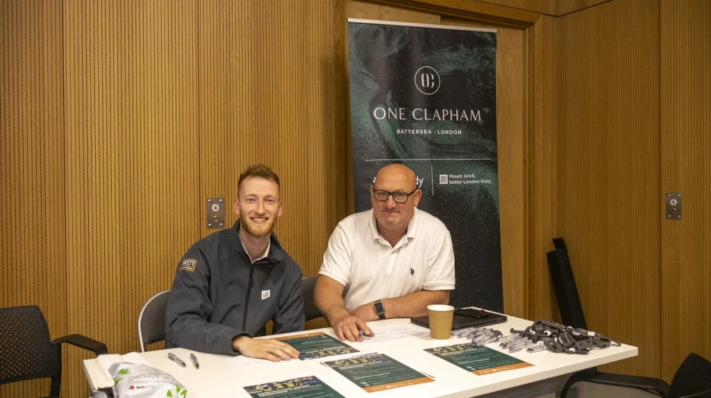 One Clapham employer representatives at a recruitment stand during a Learning for Change job fair