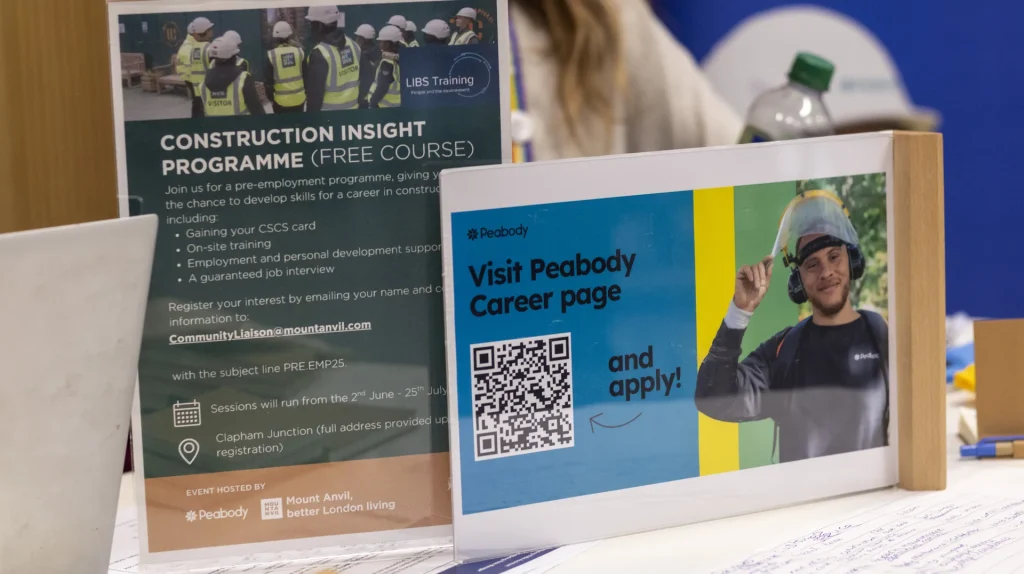 Peabody Career page flyer with QR code beside a Mount Anvil and Peabody Construction Insight Programme leaflet on a career fair table
